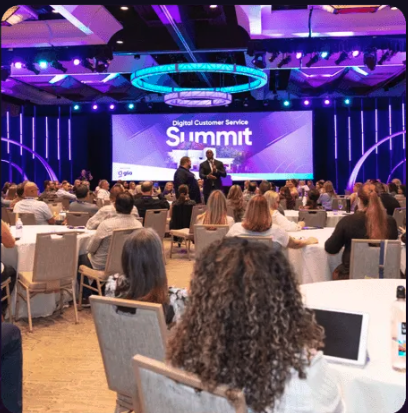 The crowd listening to the keynote session at Glia's industry conference in 2023.